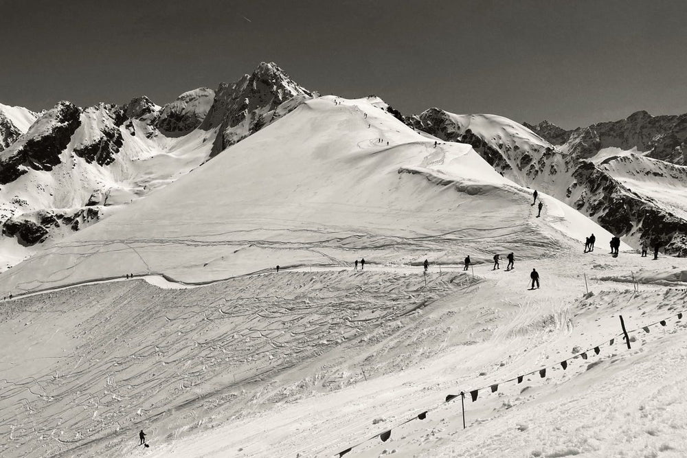 Skiers On A High-Altitude Ski Slope