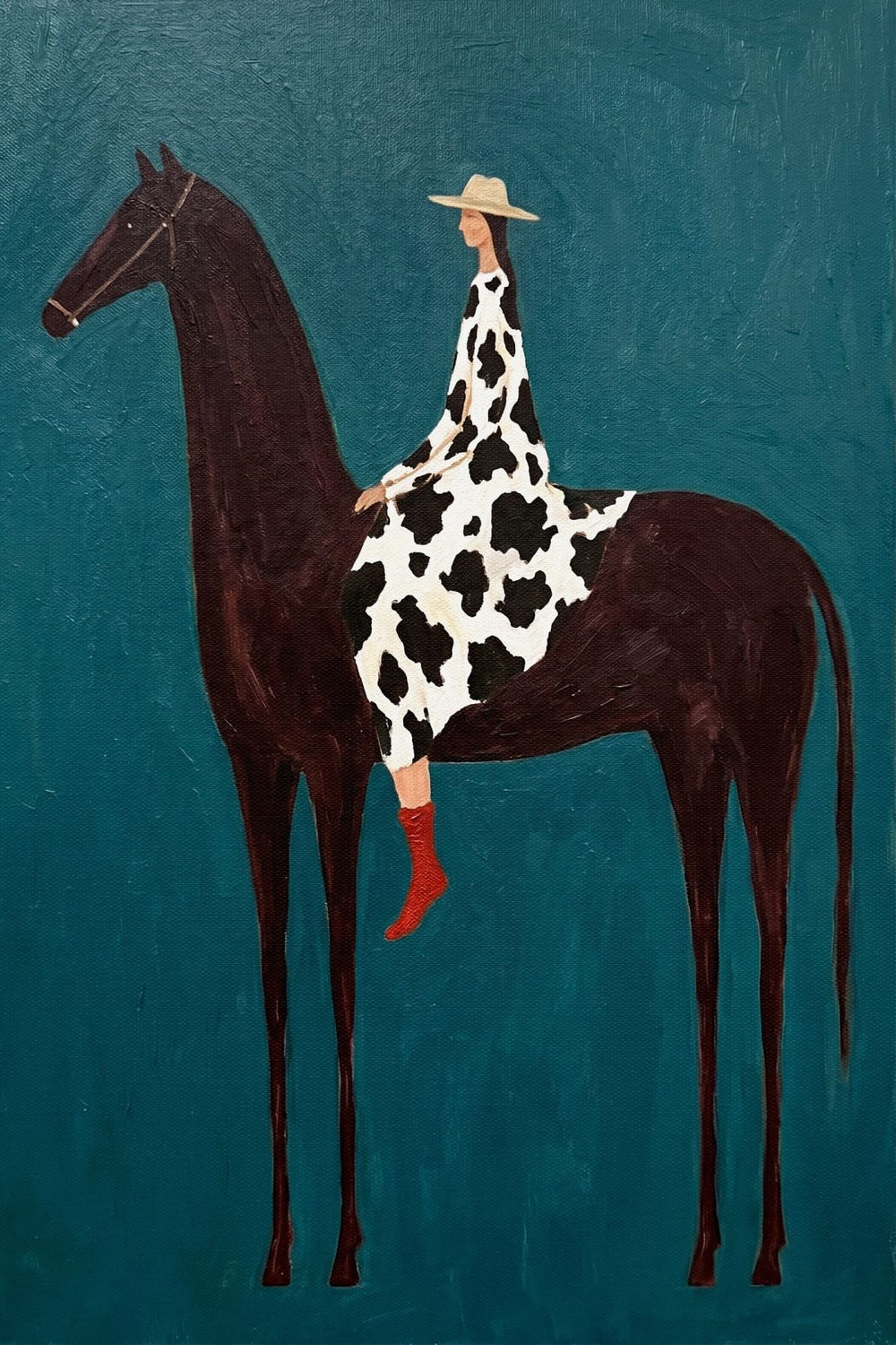 Woman on Horseback in Cow Print Dress