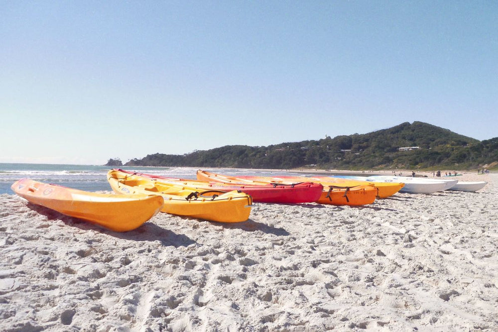 Colorful Kayaks On A Sandy Beach