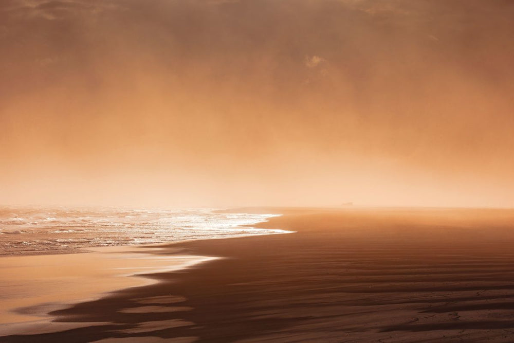 Orange-toned Sky Over The Beach