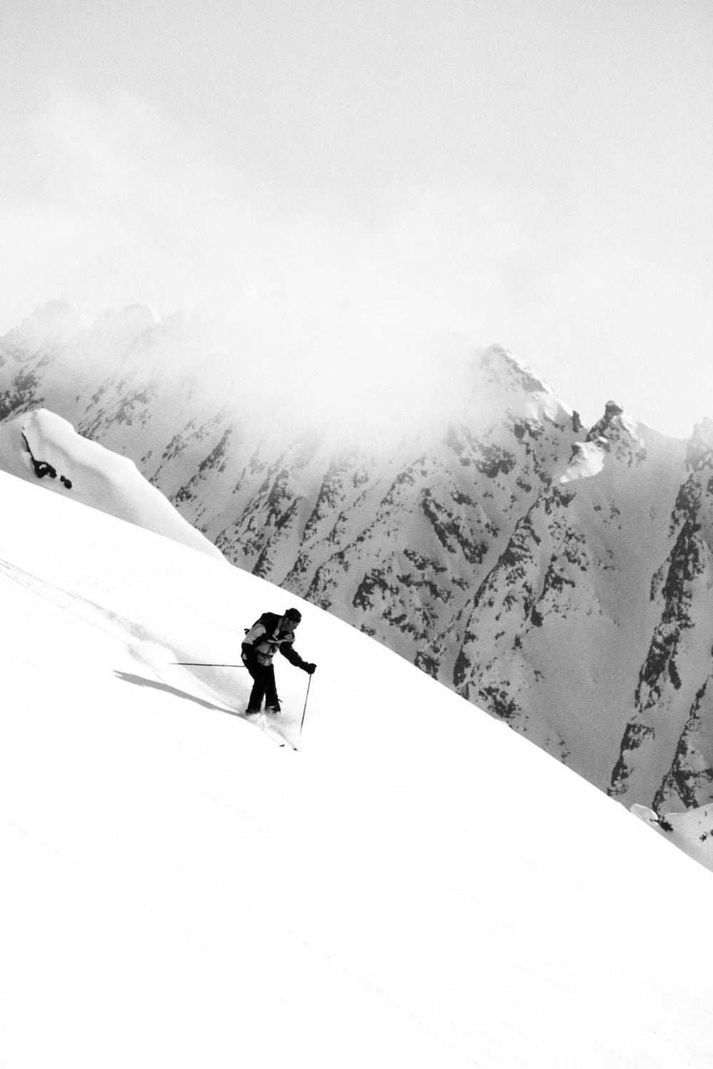 Skier On A Snowy Mountain Slope