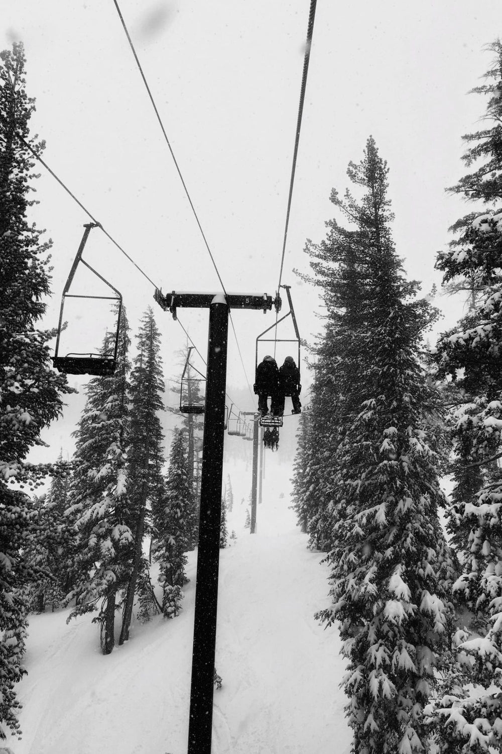 Couple Riding A Ski Lift
